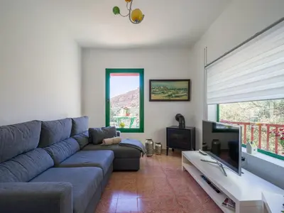Zona de estar de FAMILY COTTAGE AMONG OLIVE TREES