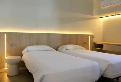 Cama o camas de una habitación en Makāi Bungalows