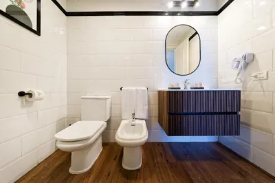 Un baño de Sunset Suites by Bull Hotels