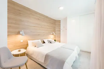 Cama o camas de una habitación en Plaza de La Feria Premium Apartments