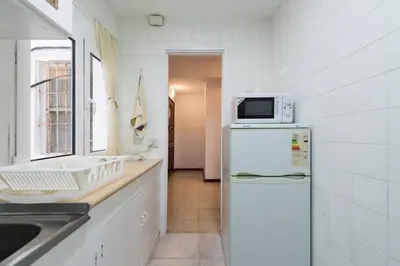 Una cocina o zona de cocina en Loft luminoso y espacioso al lado de Las Canteras