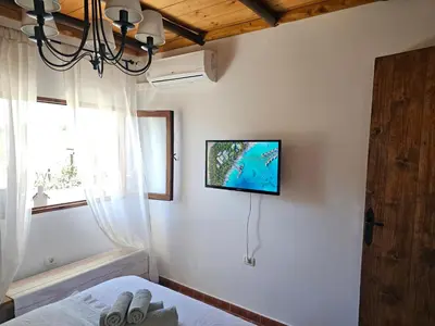 Una televisión o centro de entretenimiento en Casa Fuente Hervera