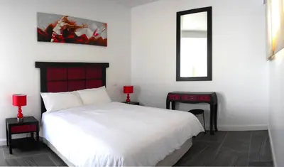 Cama o camas de una habitación en VillasRoyale Trespalomas - An Iconic Villa for Elevated Getaways!