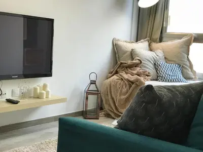 Una televisión o centro de entretenimiento en Voyage Las Canteras Beach & Parking