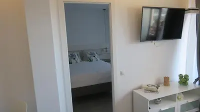 Una televisión o centro de entretenimiento en Luxury Apartment Playa del Ingles