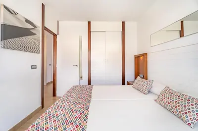 Cama o camas de una habitación en Apartamentos Cabau Altair