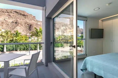 Cama o camas de una habitación en Apartamentos Cordial Mogán Paraíso