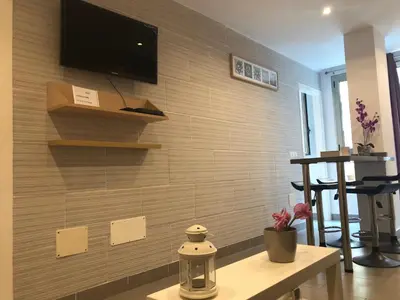 Una televisión o centro de entretenimiento en Sweet Apartment Las Canteras