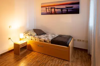 Cama o camas de una habitación en Apartamento a pie de playa