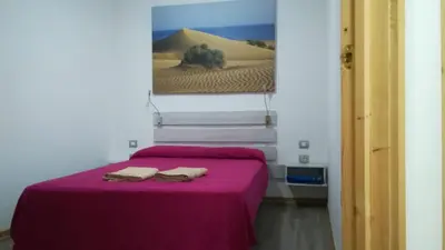 Cama o camas de una habitación en Apartamento la piedra viva 2 arinaga