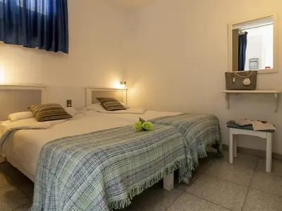 Cama o camas de una habitación en Porlamar