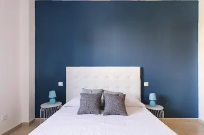 Cama o camas de una habitación en Blue & White House
