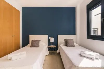 Cama o camas de una habitación en Blue & White House