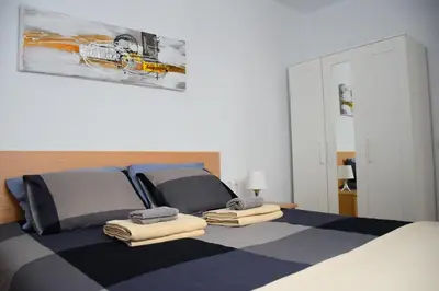 Cama o camas de una habitación en Apartments Vegueta Suite