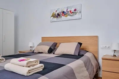 Cama o camas de una habitación en Apartments Vegueta Suite