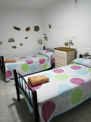 Cama o camas de una habitación en Casa rural la cruz