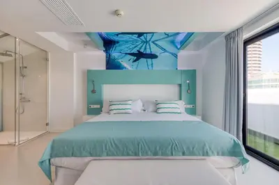 Cama o camas de una habitación en HD Acuario Lifestyle
