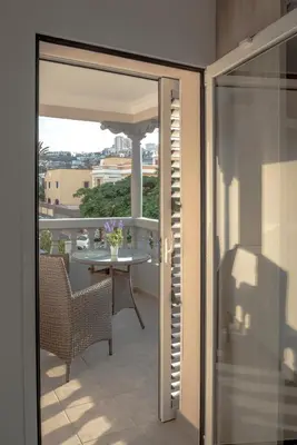 Un balcón o terraza de La Palmera Hotel Boutique