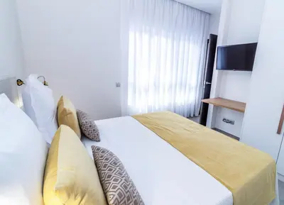 Cama o camas de una habitación en URBANSEA Holiday Homes