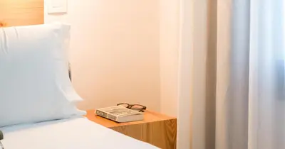 Cama o camas de una habitación en Hotel Catalina