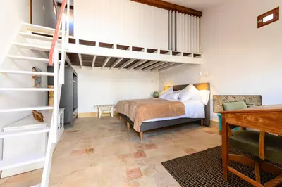 Cama o camas de una habitación en Open Air Historic Penthouse Vegueta