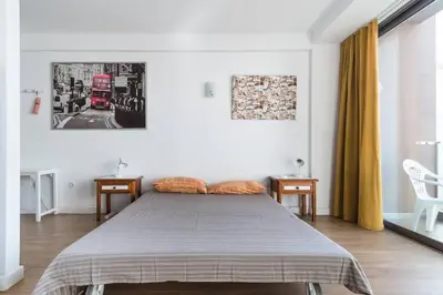 Cama o camas de una habitación en Loft moderno con balcón al lado de Las Canteras
