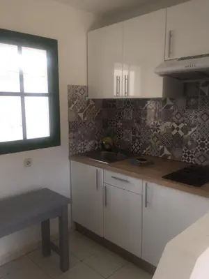 Una cocina o zona de cocina en Complejo Sun's Gardens - Maspalomas