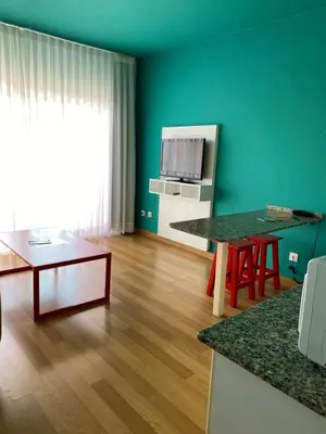 Una televisión o centro de entretenimiento en Hotel Ritual Maspalomas - Adults Only