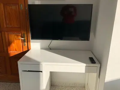 Una televisión o centro de entretenimiento en TABLERO 204, Espléndido apto 8 pax cerca Playa Inglés