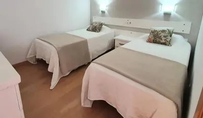 Cama o camas de una habitación en Apartamentos Horizonte