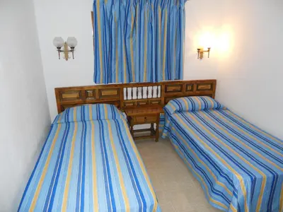 Cama o camas de una habitación en Apartamentos Los Juncos II