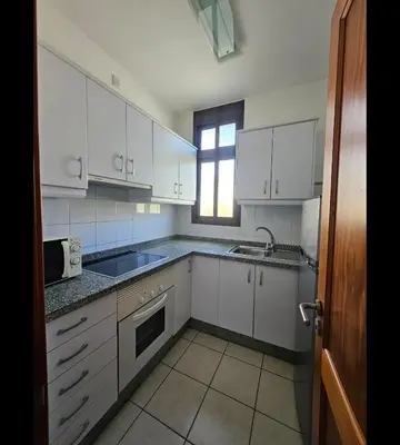 Una cocina o zona de cocina en Apartamentos Ciudad Jardín