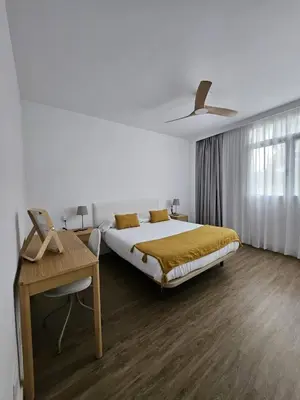 Cama o camas de una habitación en Apartamentos Ciudad Jardín