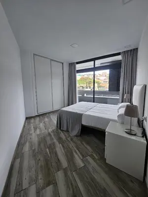 Cama o camas de una habitación en Apartamentos Ciudad Jardín