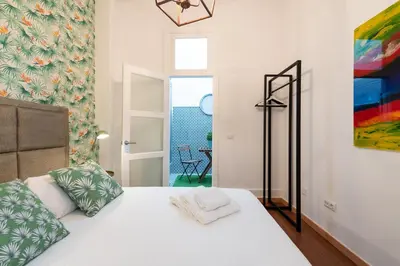Cama o camas de una habitación en Apartamentos Vegueta