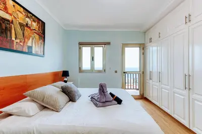 Cama o camas de una habitación en Luxury 5 star Villa Violetta with amazing sea view, jacuzzi and heated pool