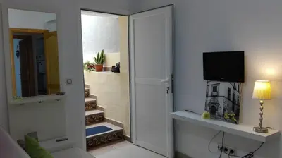 Una televisión o centro de entretenimiento en Casa cerca del campo y la ciudad