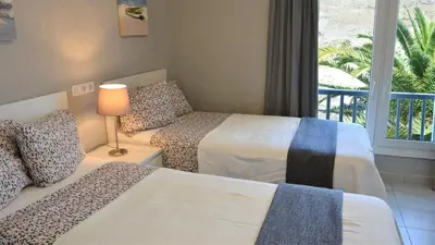 Cama o camas de una habitación en Casa La Palmera - Holiday house close to the beach