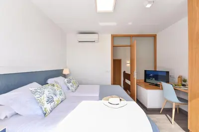 Cama o camas de una habitación en BeachFront Suites Morea Puerto Rico by VillaGranCanaria