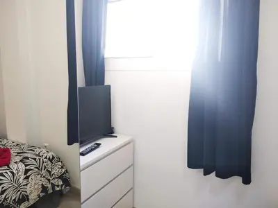 Una televisión o centro de entretenimiento en Apartaments Vacations Playa del Ingles
