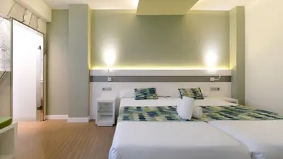 Cama o camas de una habitación en Hotel Aloe Canteras