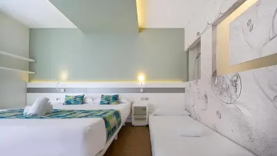 Cama o camas de una habitación en Hotel Aloe Canteras