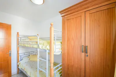 Cama o camas de una habitación en Apartment 3 minutes from Puerto Rico beach