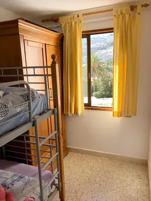 Cama o camas de una habitación en Apartment 3 minutes from Puerto Rico beach