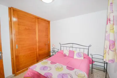 Cama o camas de una habitación en Apartment 3 minutes from Puerto Rico beach