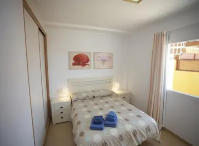 Cama o camas de una habitación en Golden Beach n 12, top floor apartment with private roof terrace by El Sirocco