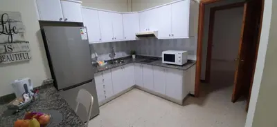 Una cocina o zona de cocina en Rosyshome102