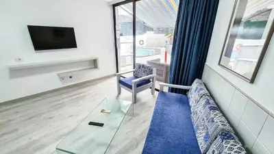 Una televisión o centro de entretenimiento en Apartamentos Monte Verde