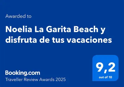 Certificado, premio, señal o documento que está expuesto en Noelia La Garita Beach y disfruta de tus vacaciones