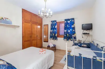 Cama o camas de una habitación en Casa Pilar con piscina